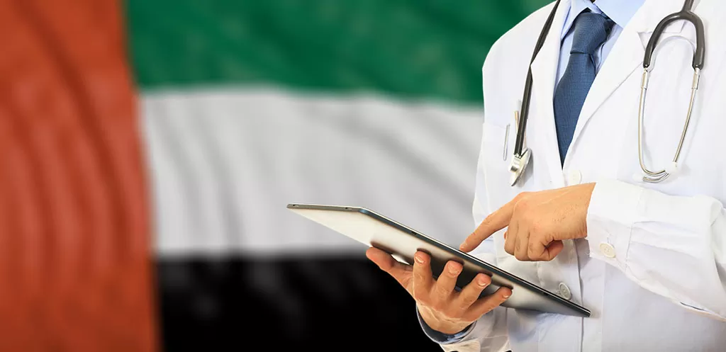 Doctor on UAE flag background.